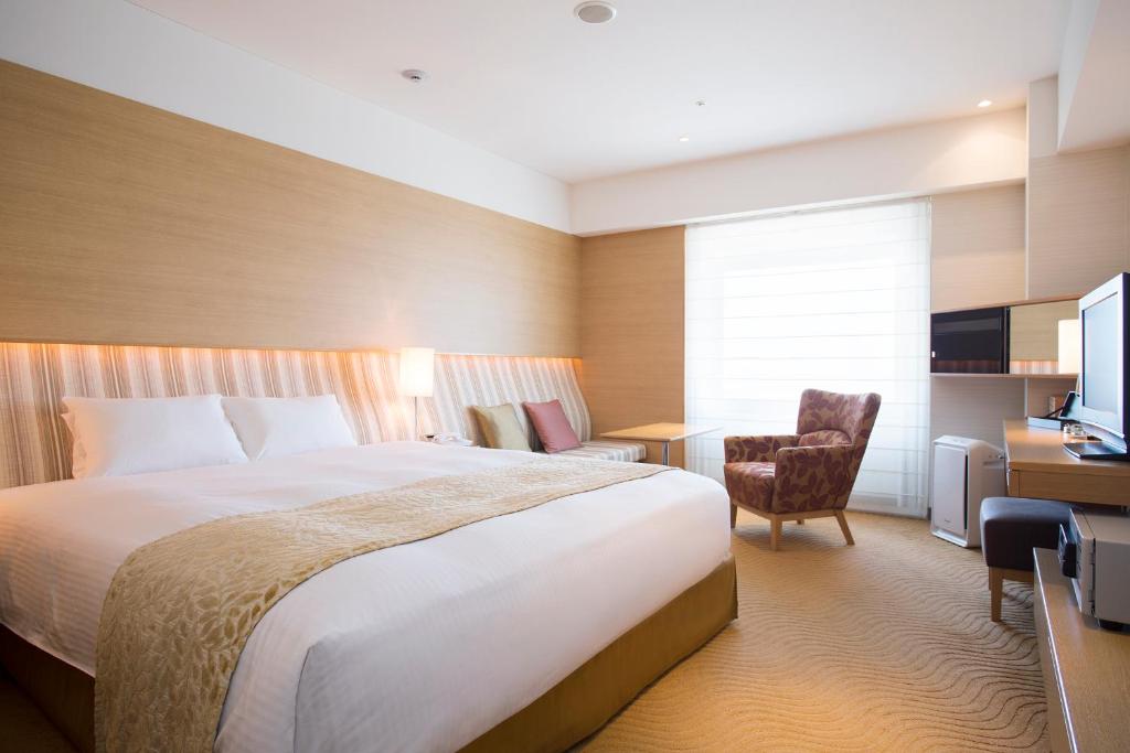 En eller flere senge i et værelse på Hotel Nikko Kansai Airport - 3 mins walk to the airport
