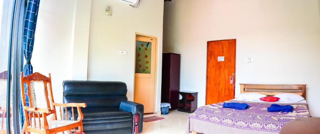 Postel nebo postele na pokoji v ubytování Kandy View Hotel