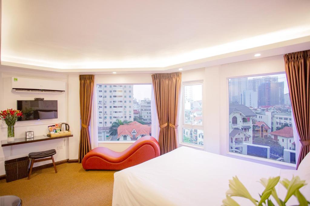 Postel nebo postele na pokoji v ubytování Dinh Hotel