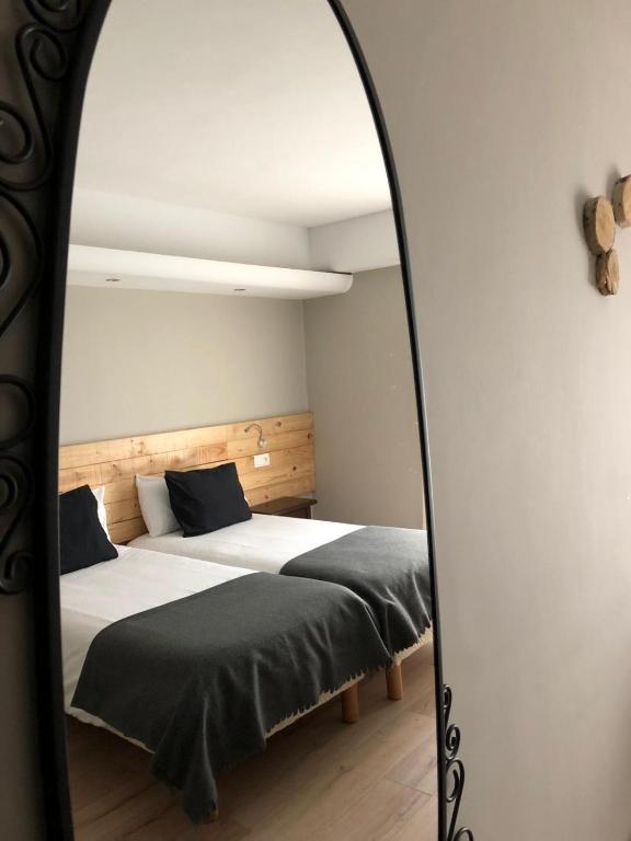 Postel nebo postele na pokoji v ubytování L'Oree du Bois