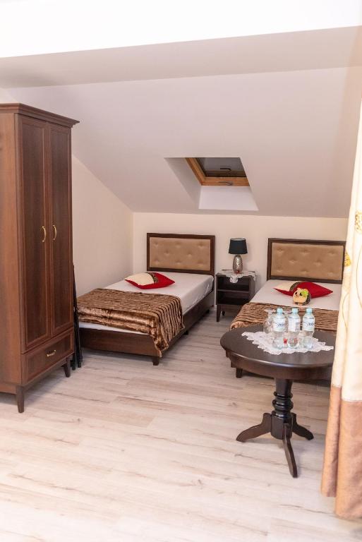 Postel nebo postele na pokoji v ubytování Hotel Artur
