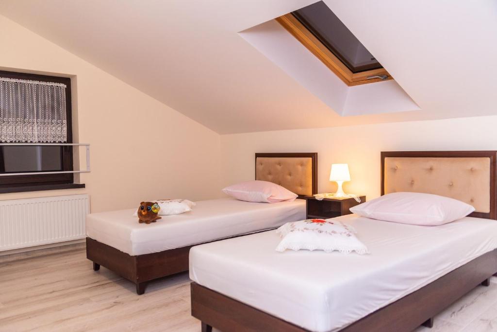 Postel nebo postele na pokoji v ubytování Hotel Artur