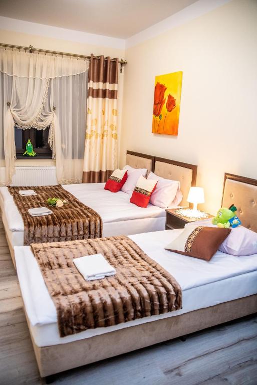 Postel nebo postele na pokoji v ubytování Hotel Artur