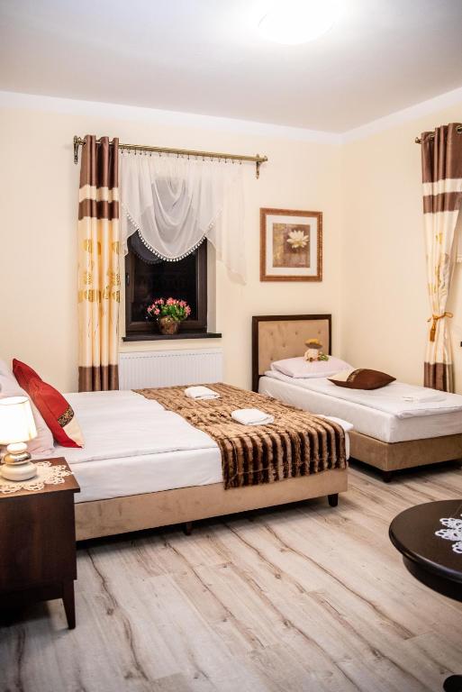 Postel nebo postele na pokoji v ubytování Hotel Artur