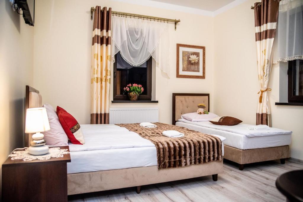 Postel nebo postele na pokoji v ubytování Hotel Artur