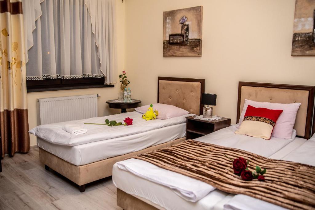 Postel nebo postele na pokoji v ubytování Hotel Artur