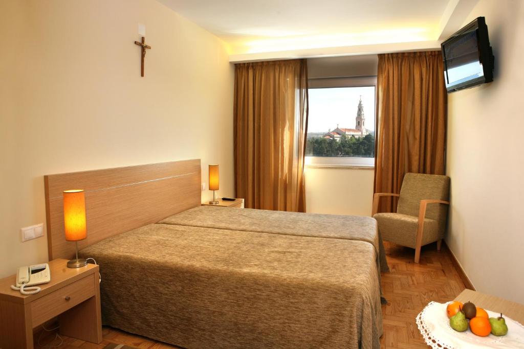 Postel nebo postele na pokoji v ubytování Hotel Casa Sao Nuno