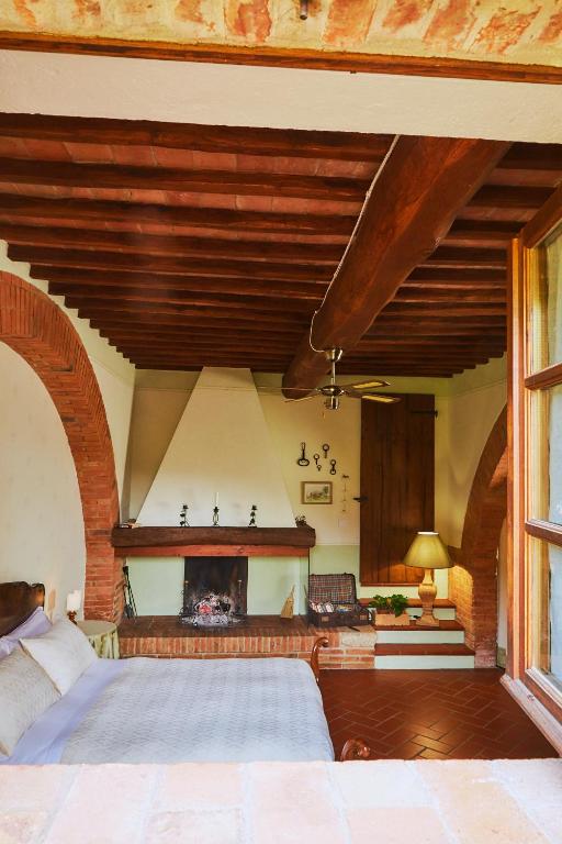Postel nebo postele na pokoji v ubytování Agriturismo Villa Mazzi
