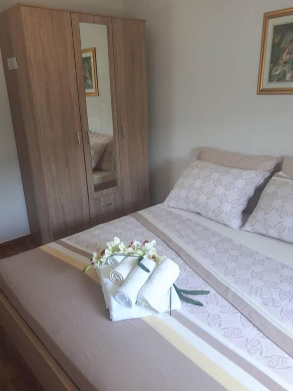 Postel nebo postele na pokoji v ubytování Apartments Ante-Gojko