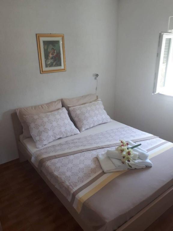 Postel nebo postele na pokoji v ubytování Apartments Ante-Gojko