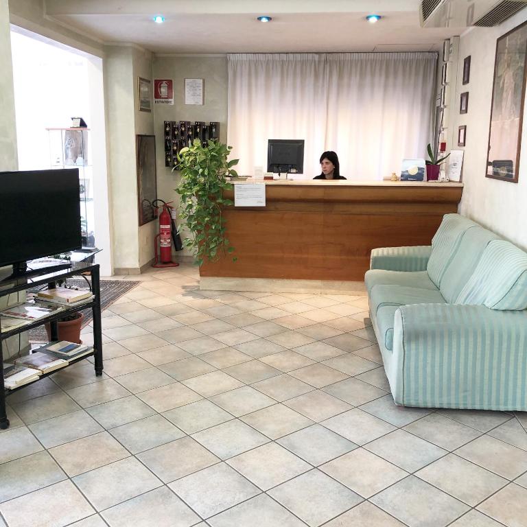 TV a/nebo společenská místnost v ubytování Albergo La Posta Arezzo