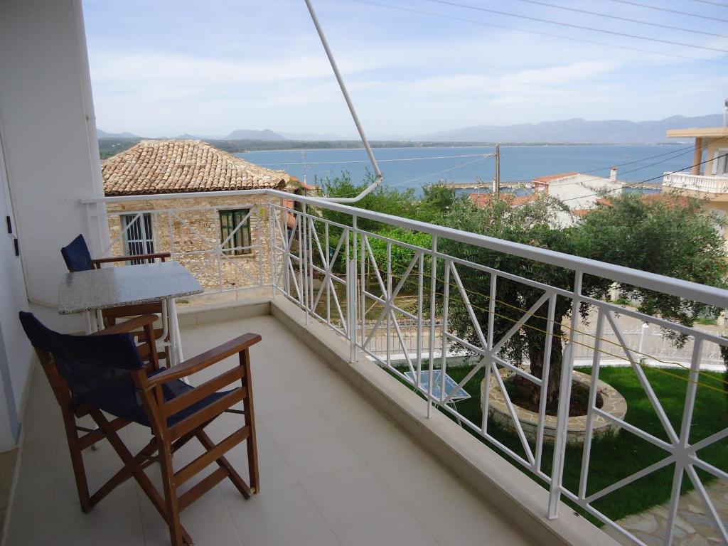 a balcony with a view of the water at Erato Apartments in Petalidi