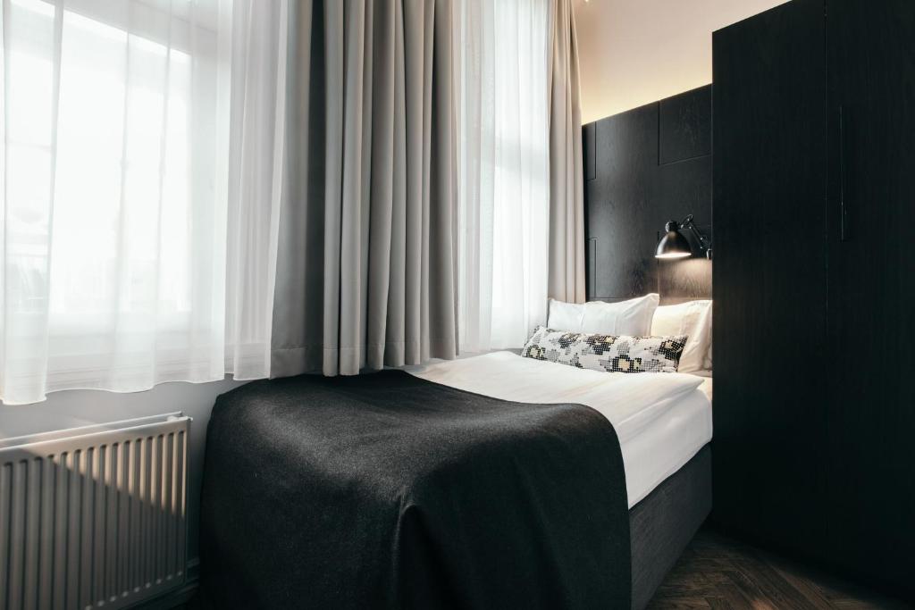 Postel nebo postele na pokoji v ubytování Apótek Hotel Reykjavík by Keahotels