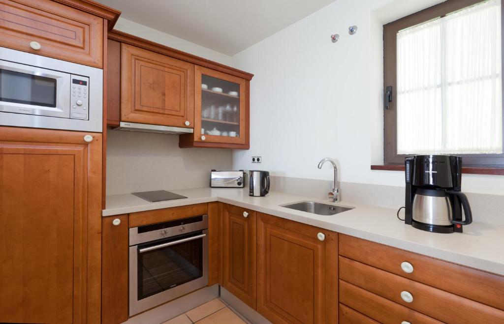 Kuchyň nebo kuchyňský kout v ubytování Hotel Suite Villa Maria