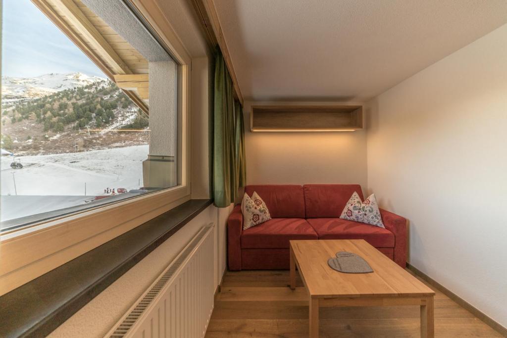 A seating area at Das Hochegg - Apartments
