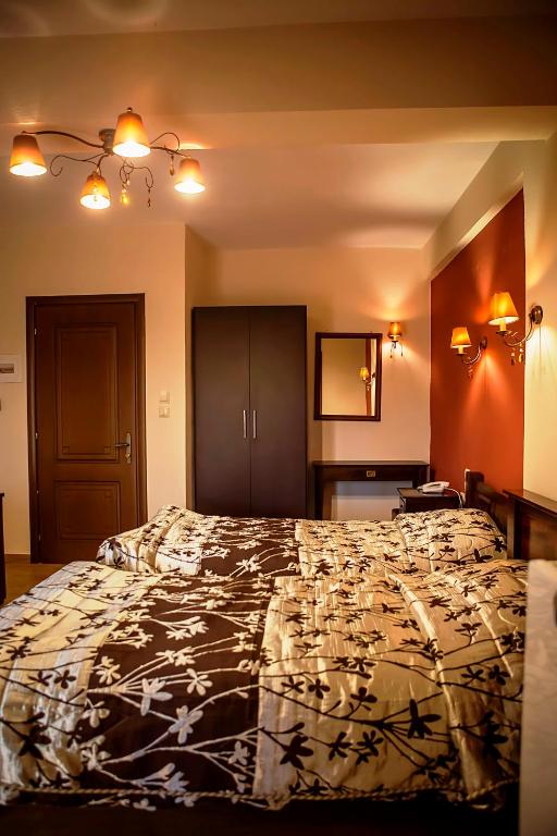 Posteľ alebo postele v izbe v ubytovaní Andromeda Hotel Limni Plastira