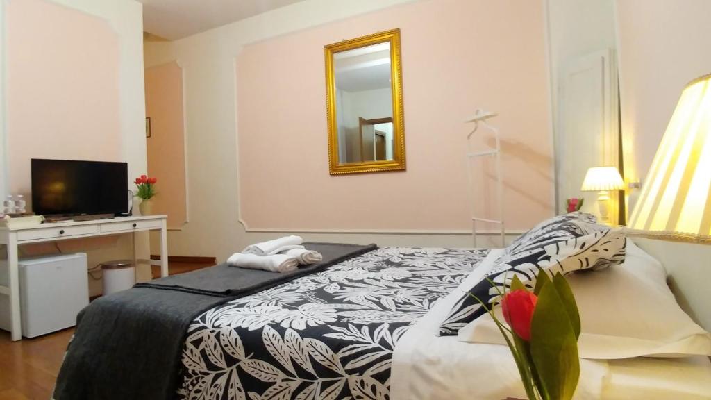 Llit o llits en una habitació de Dreaming Navona Rooms