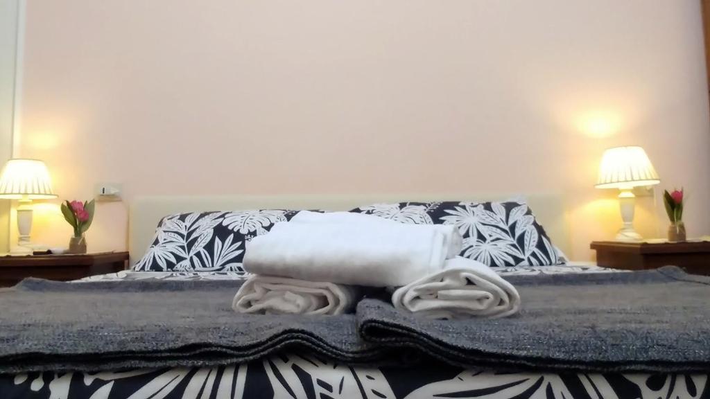 Llit o llits en una habitació de Dreaming Navona Rooms
