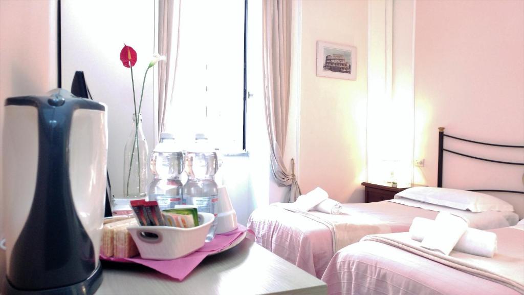 Llit o llits en una habitació de Dreaming Navona Rooms