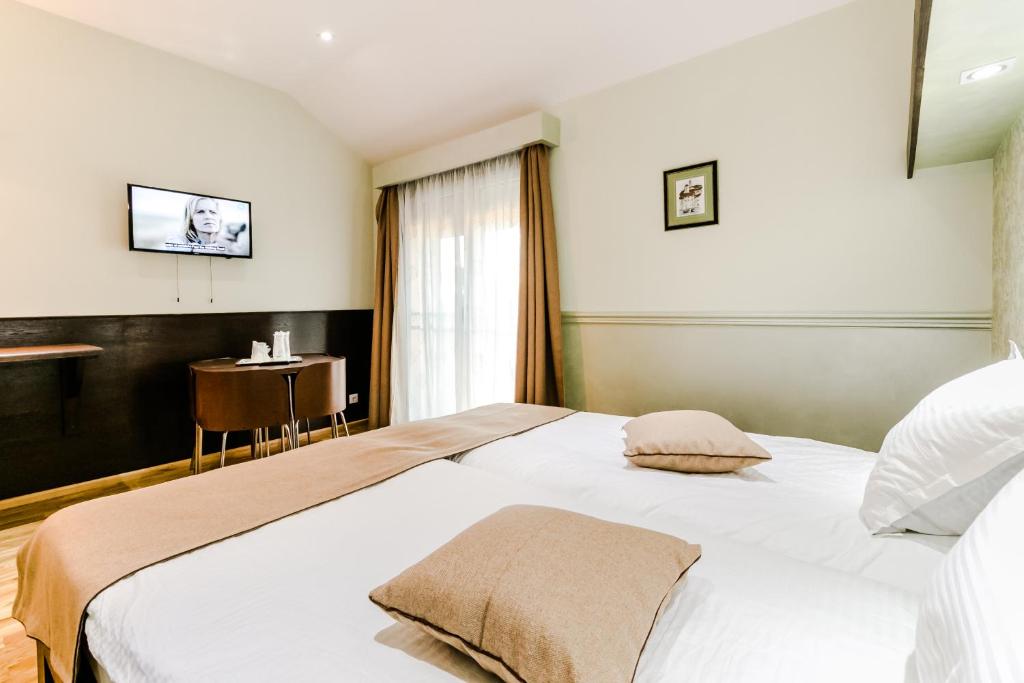 Posteľ alebo postele v izbe v ubytovaní Hotel Marina