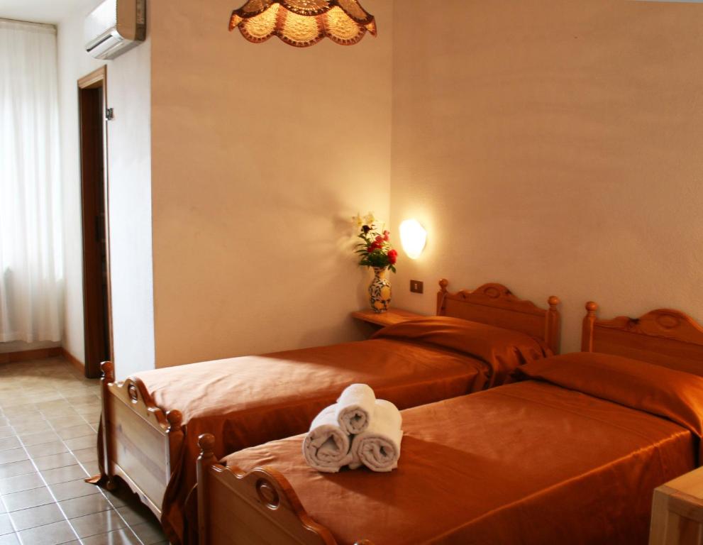 Postel nebo postele na pokoji v ubytování Hotel Residence Turium