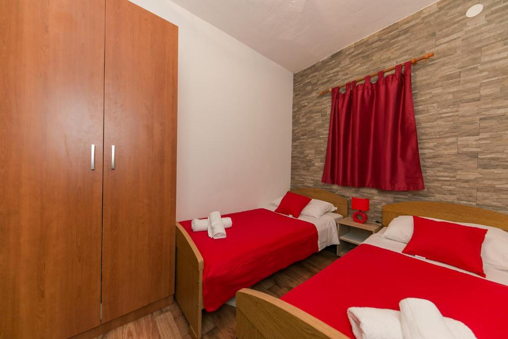 Postel nebo postele na pokoji v ubytování Apartments Vukman