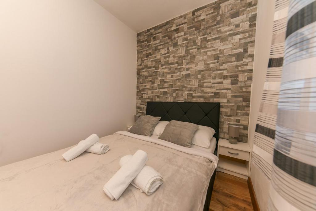 Postel nebo postele na pokoji v ubytování Apartments Vukman