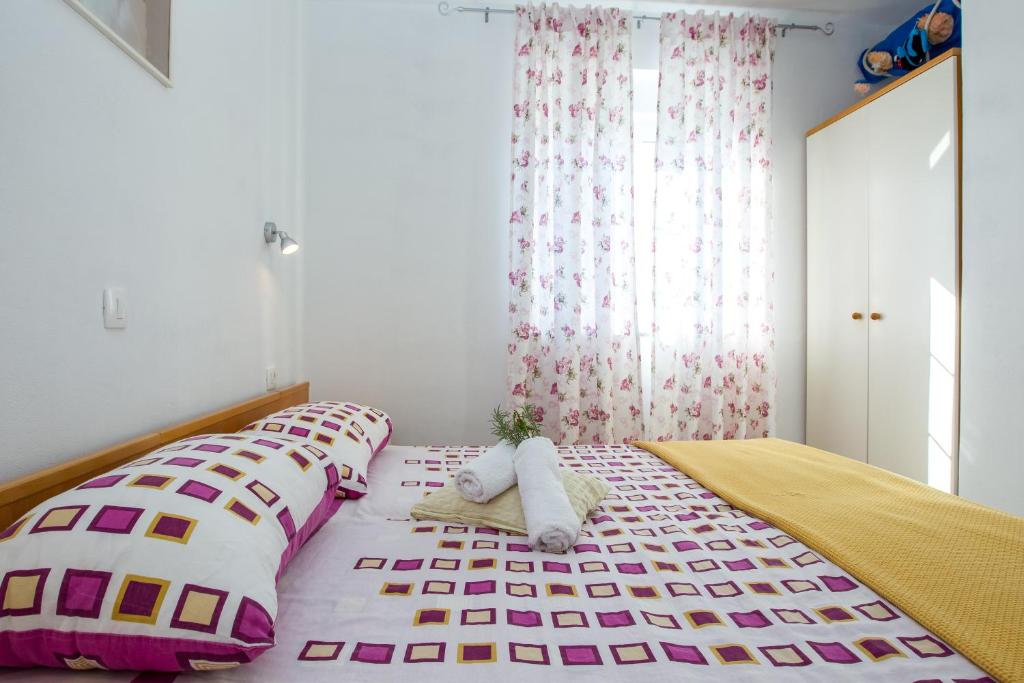 Postel nebo postele na pokoji v ubytování Apartments Luka