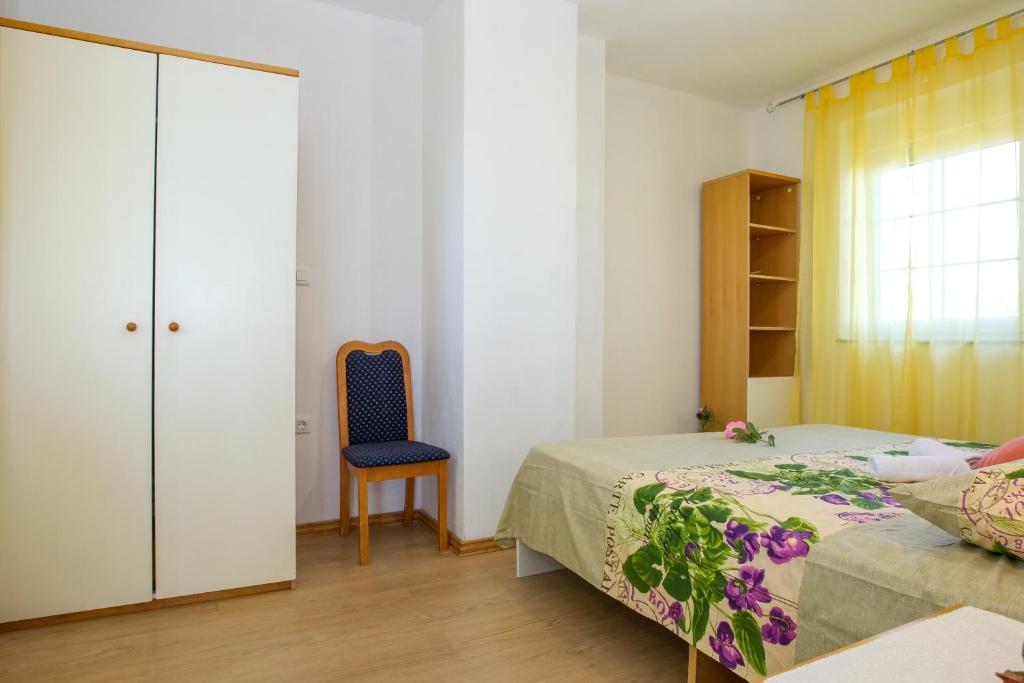 Postel nebo postele na pokoji v ubytování Apartments Luka