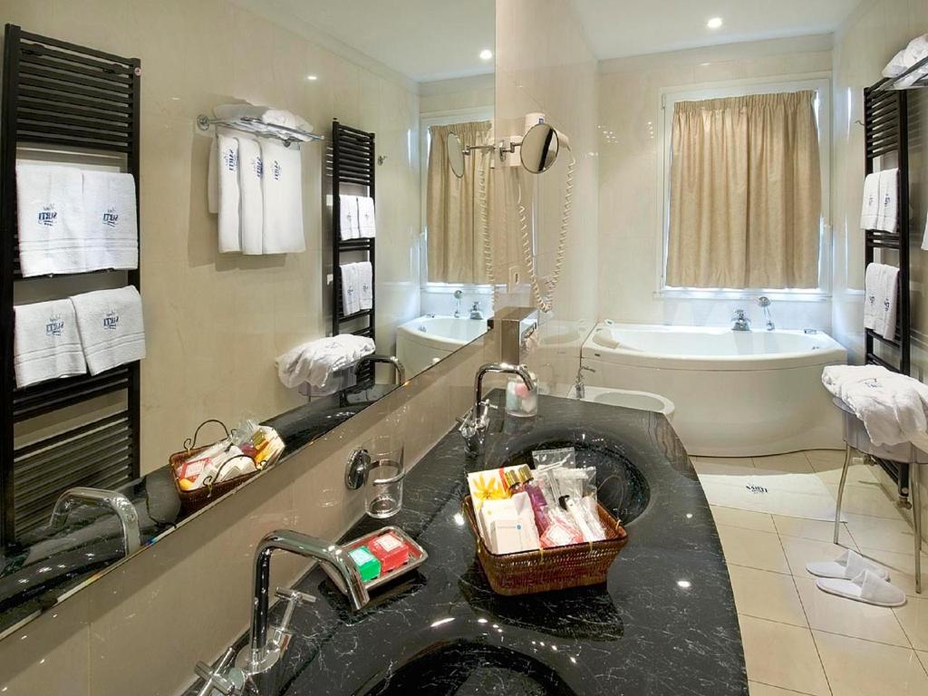 Koupelna v ubytování Hotel Sarti