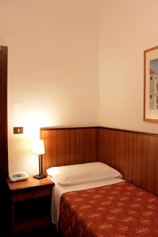 Posteľ alebo postele v izbe v ubytovaní Hotel Umbria