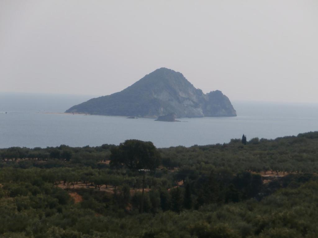 an island in the middle of a body of water at Pansion Porto Tsi Ostrias in Keri