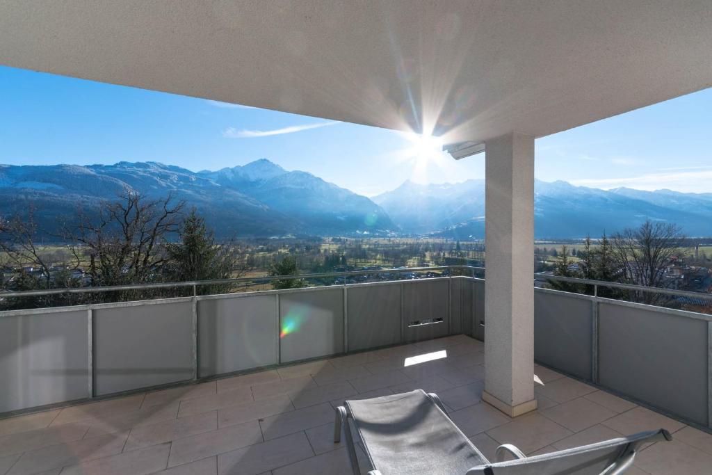 a balcony with a view of the mountains at Ski-n-Lake - The Alps View Apartment in Zell am See