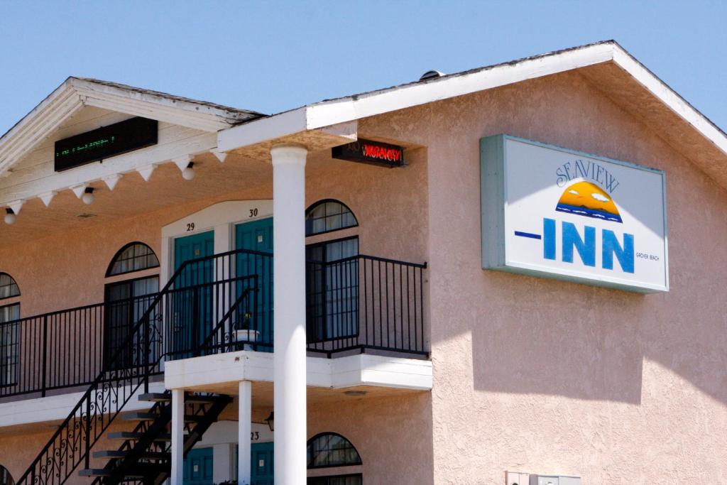 a inn with a sign on the side of a building at Seaview Inn Grover Beach in Grover Beach