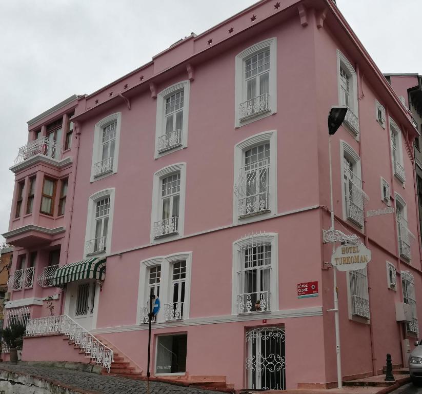 a pink building on the side of a street at Turkoman Hotel in Istanbul