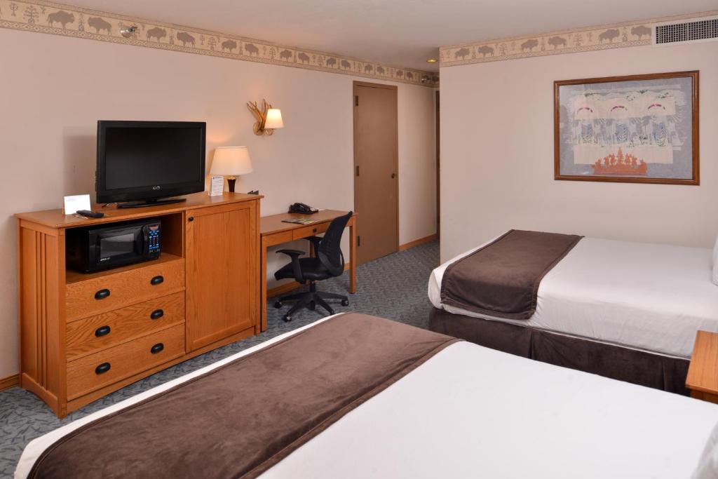 Letto o letti in una camera di Stage Coach Inn