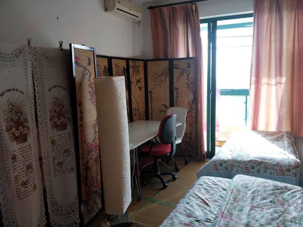 Postel nebo postele na pokoji v ubytování Yi Ju Homestay-ZhuanQiao Subway Station, MinHang District