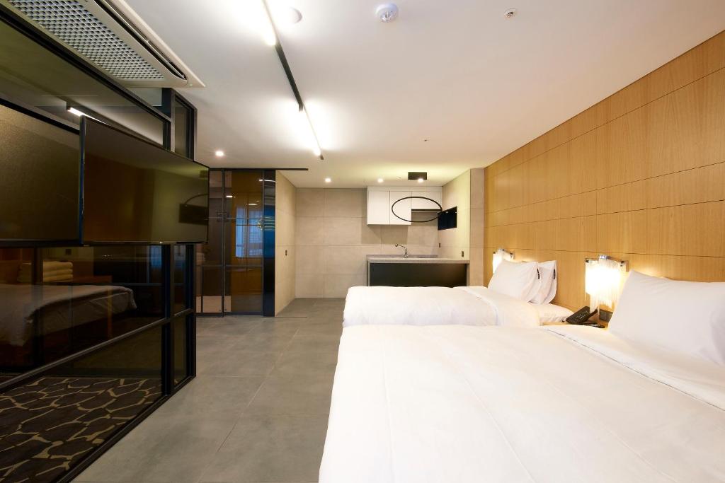 Säng eller sängar i ett rum på Hotel tt Seomyeon
