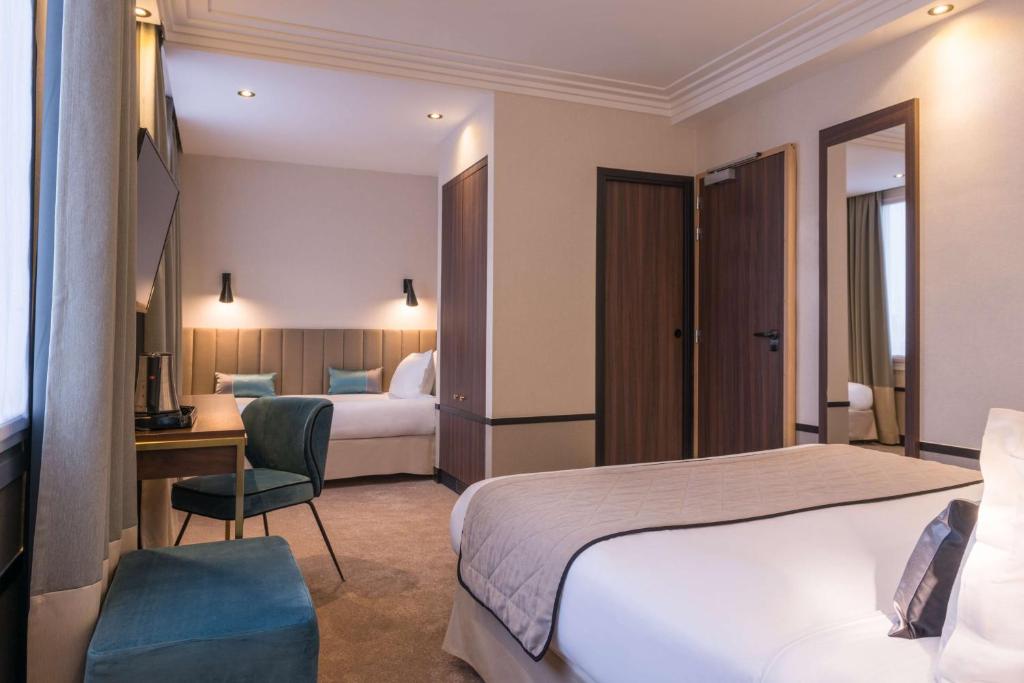 a hotel room with a bed and a desk at Best Western Select Hotel in Boulogne-Billancourt