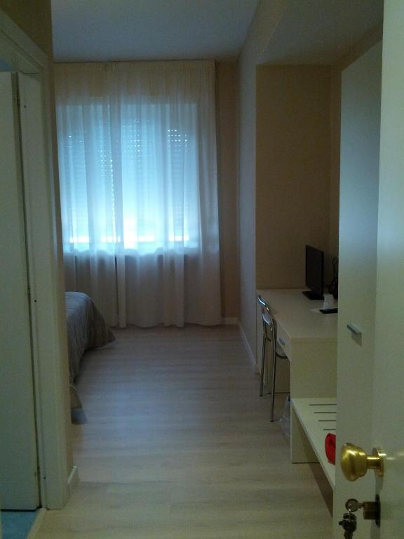 TV a/nebo společenská místnost v ubytování Hotel Cremona Viale