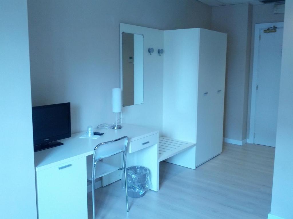 TV a/nebo společenská místnost v ubytování Hotel Cremona Viale