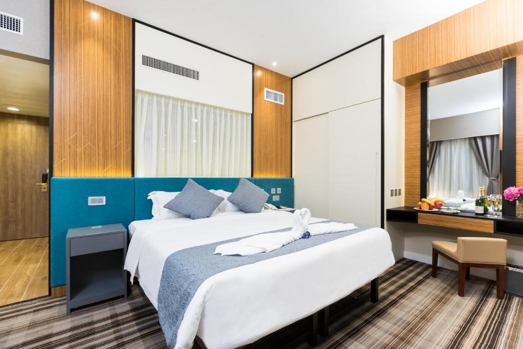 Postel nebo postele na pokoji v ubytování Eco Tree Hotel Causeway Bay