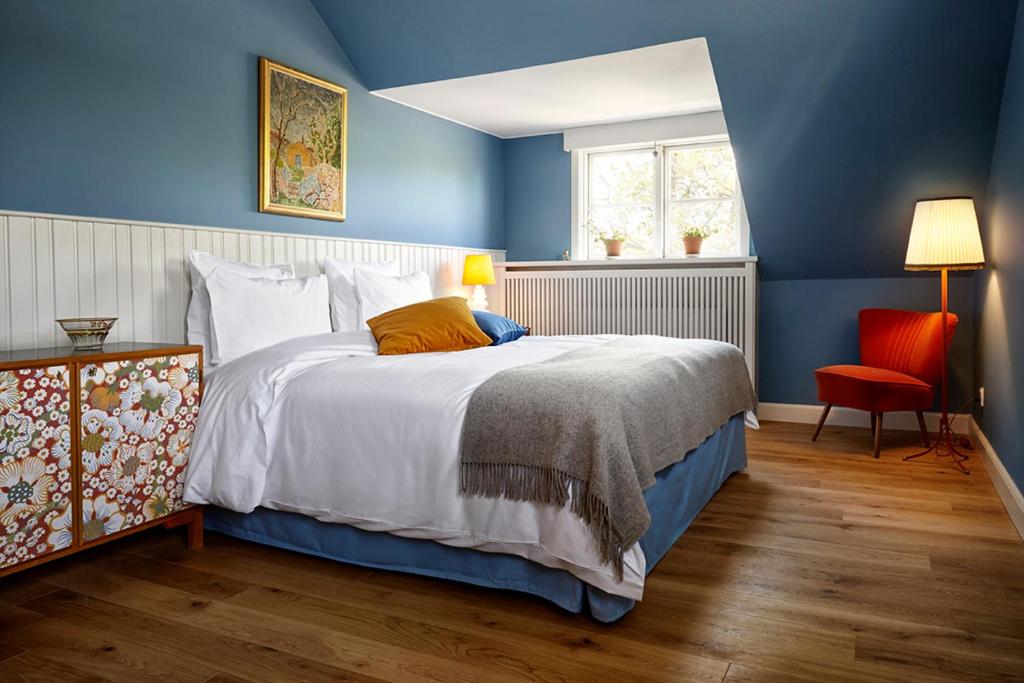 Postel nebo postele na pokoji v ubytování Hotel Hornbækhus