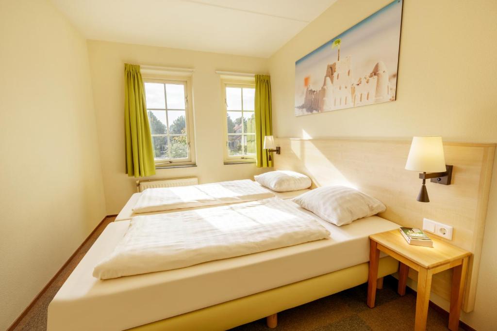 Postel nebo postele na pokoji v ubytování Center Parcs Port Zélande beach
