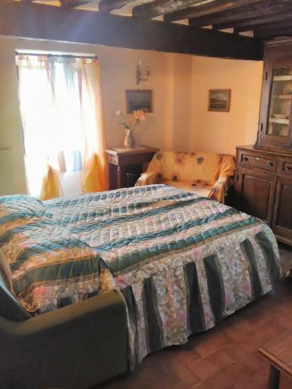 Postel nebo postele na pokoji v ubytování Casa Vacanza Lucignano