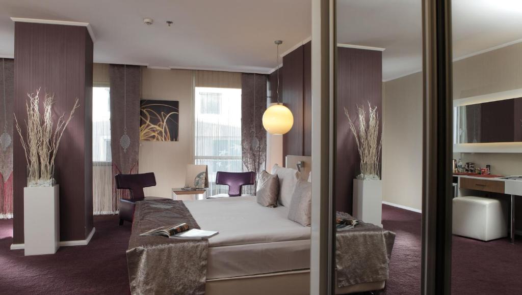 Ένα ή περισσότερα κρεβάτια σε δωμάτιο στο City Hotel Ankara