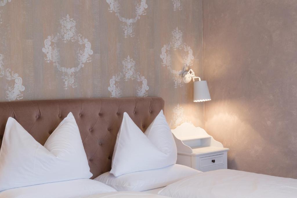 Postel nebo postele na pokoji v ubytování Boutique Hotel Olympia