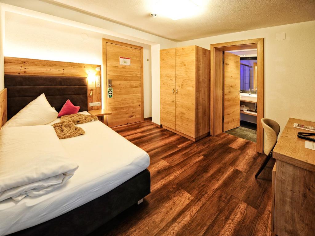 Postel nebo postele na pokoji v ubytování Hotel Ferienglück