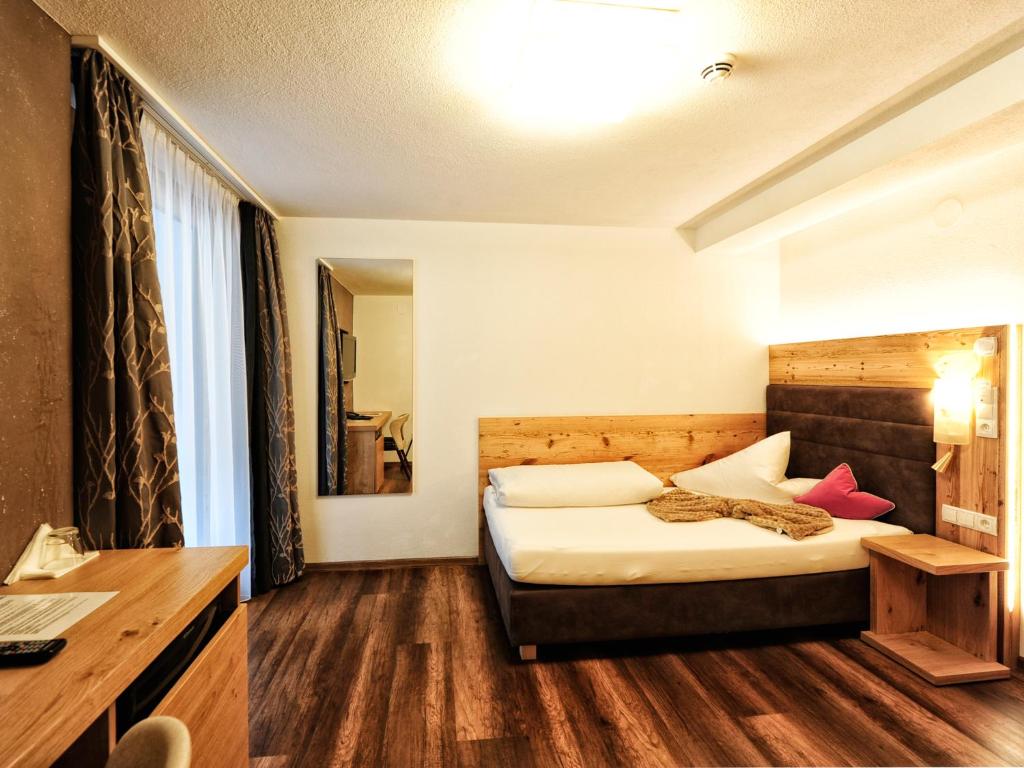 Postel nebo postele na pokoji v ubytování Hotel Ferienglück