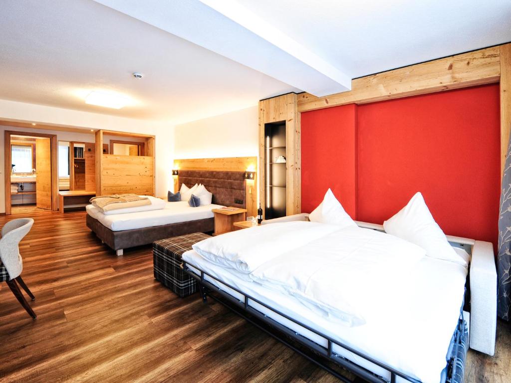 Postel nebo postele na pokoji v ubytování Hotel Ferienglück